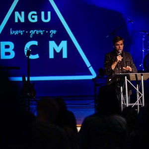 Joshua Gilmore speaking at a BCM event