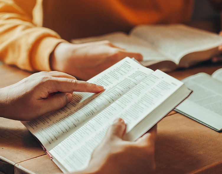 group of people reading the Bble