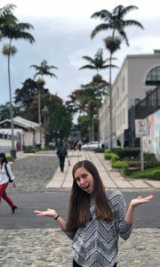 Sarah Scism in Costa Rica by palm trees.