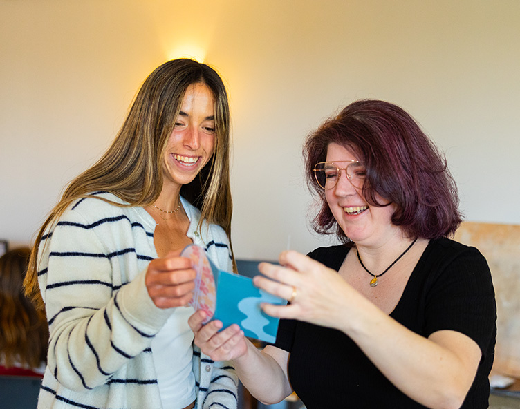 student reviewing design work with teacher