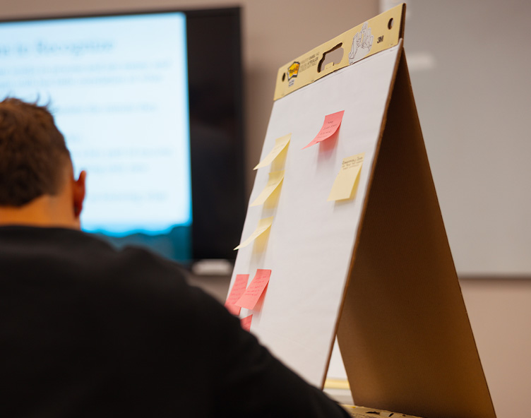 student completing homework in a classroom
