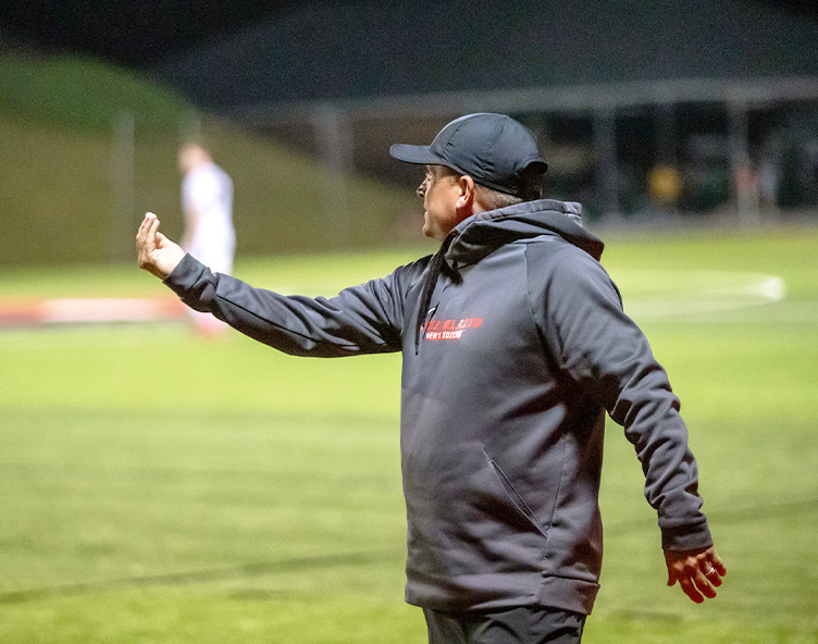 coach on a soccer field