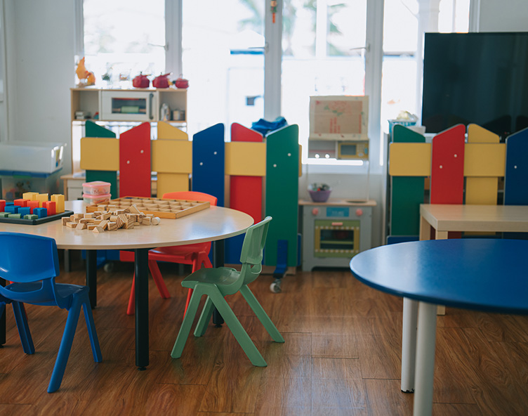 tables and chairs in young child's classroom and playroom