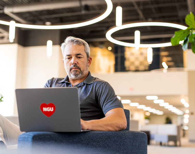 student studying with a laptop