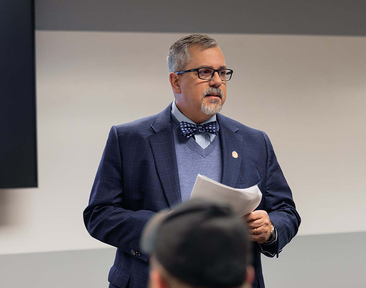professor giving a lecture at a criminal justice event