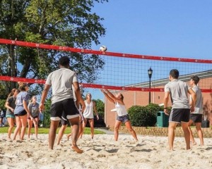 NGU students playing volleyball on campus