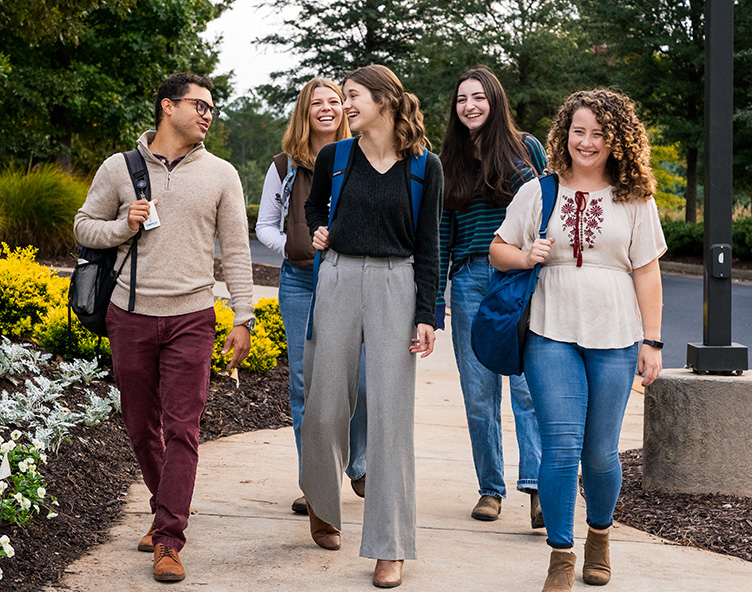 students walking through campus
