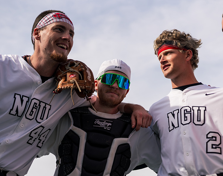 players posing on a baseball field