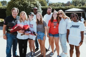 Fants pose with students at the NGU student tailgate.