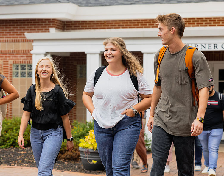 students walking through campus