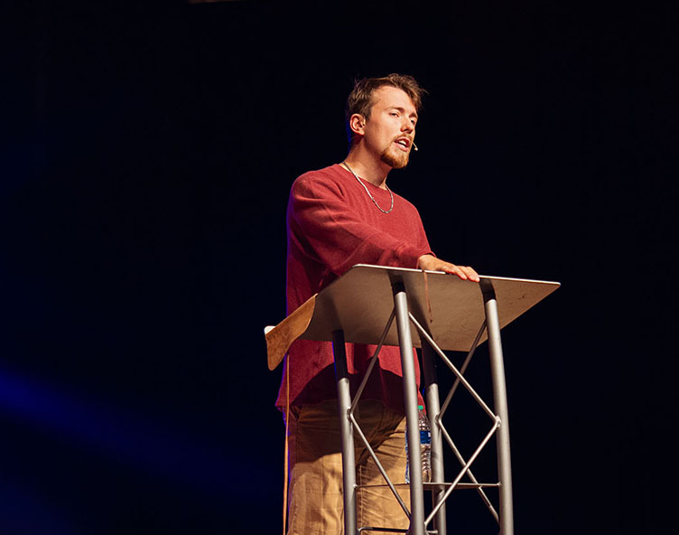 student speaking at chapel