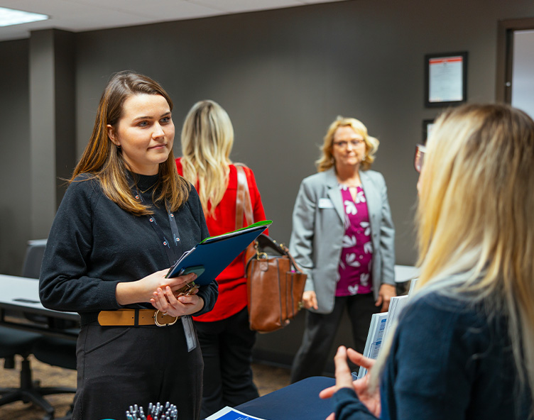 student talking to potential employer