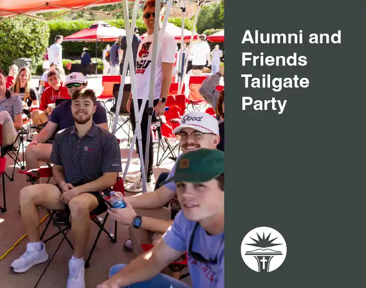 students and alumni sitting in fold up chairs outdoors